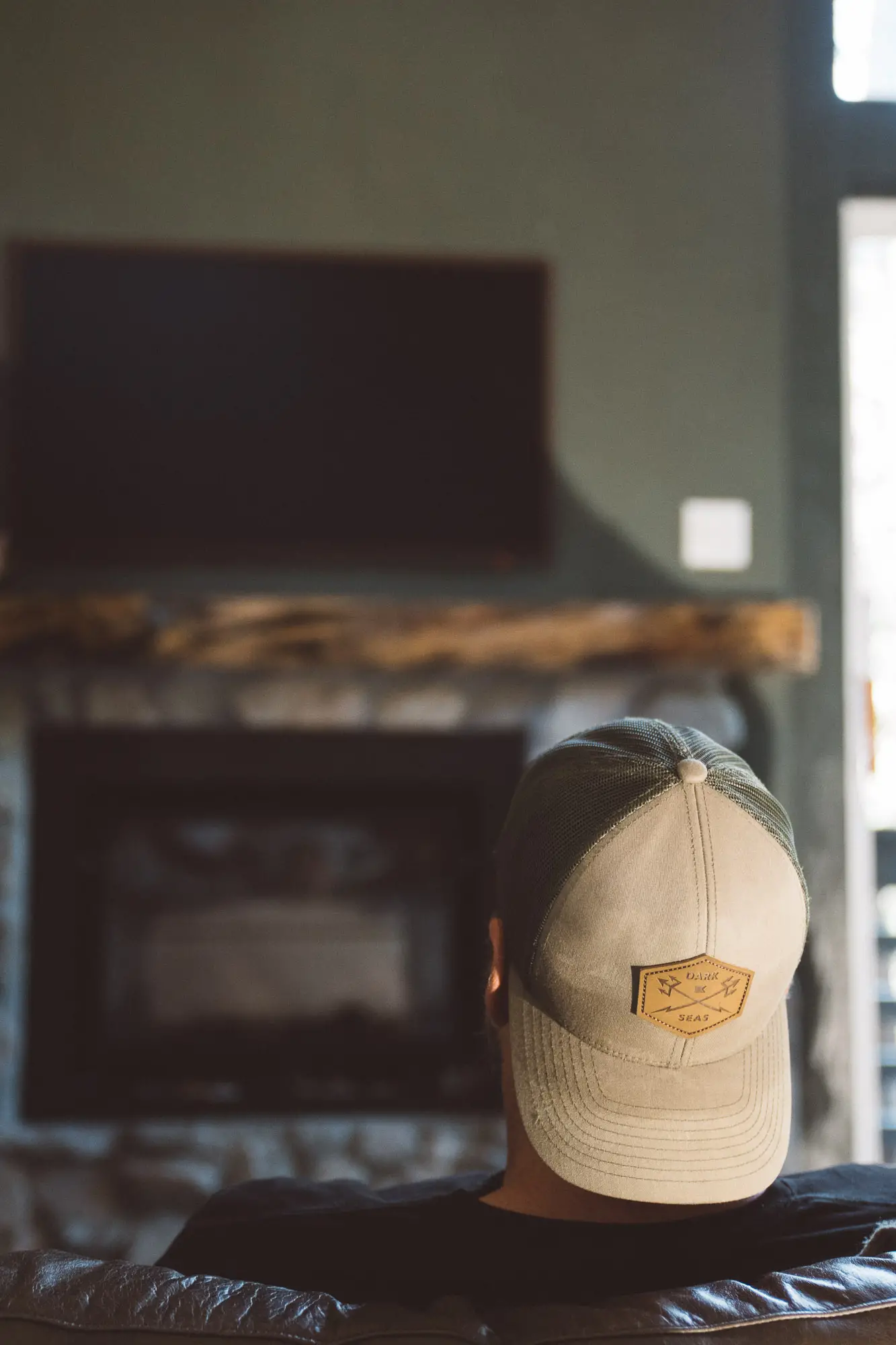 Man with backwards cap enjoying the cabin comforts of Freewyld in Idyllwild